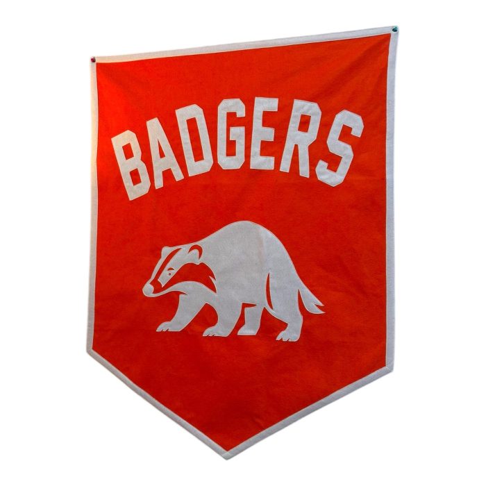 Red-orange felt Badgers team banner with a cream felt badger