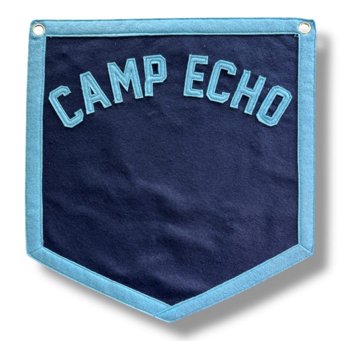 Navy felt Camp Echo pennant with light blue lettering and trim