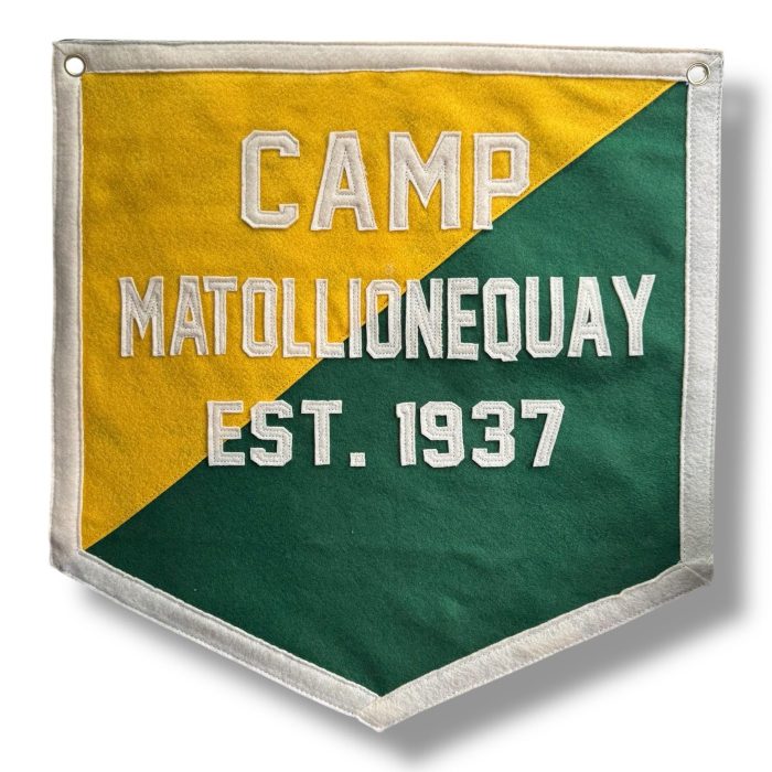 Yellow and green split felt banner reading Camp Matollionequay Est. 1937