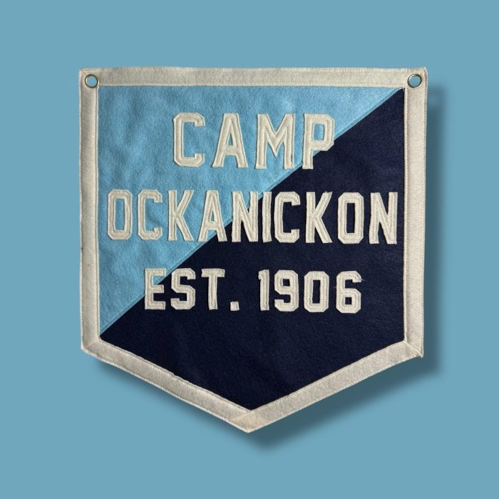 Light blue and navy split felt banner reading Camp Ockanickon Est. 1906