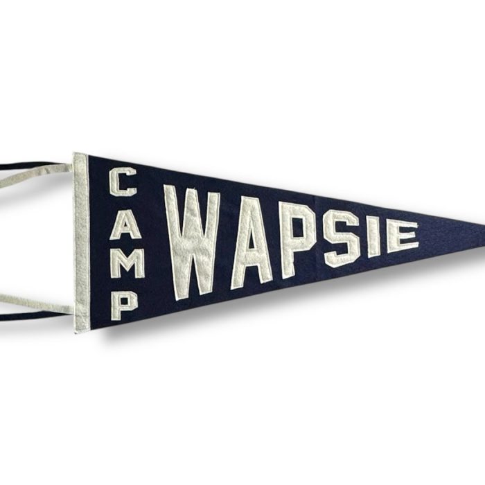 Navy felt Camp Wapsie pennant with cream lettering and ribbon tails