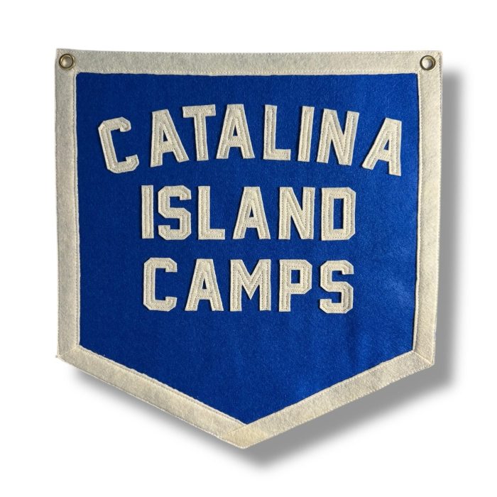 Blue felt banner reading Catalina Island Camps in cream lettering