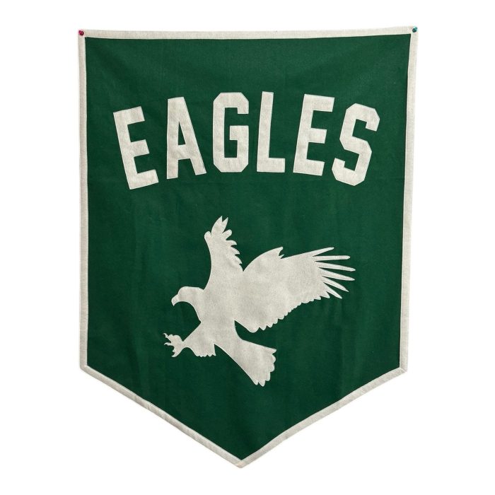 Green felt Eagles team banner with a cream felt eagle