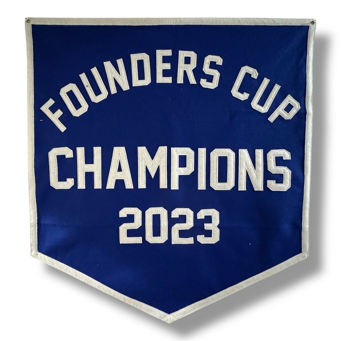 Blue felt banner reading Founders Cup Champions 2023 in cream lettering