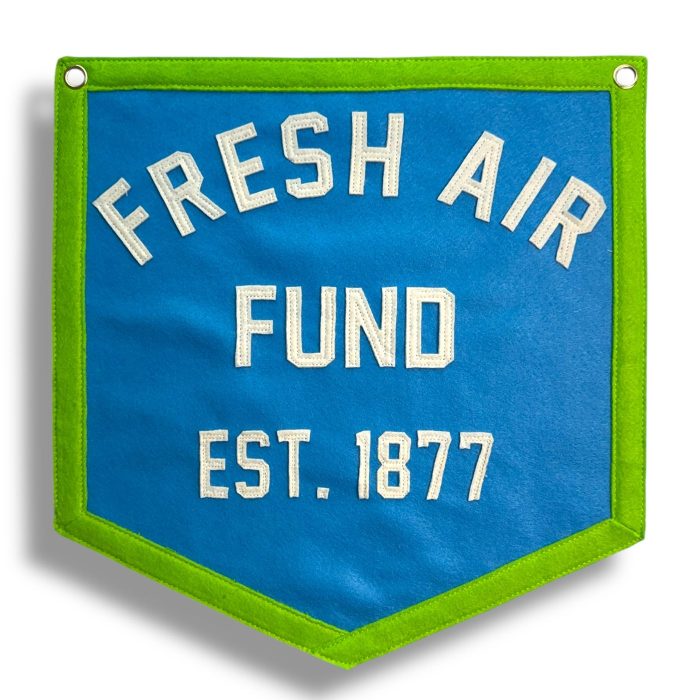 Blue felt banner with green trim reading Fresh Air Fund Est. 1877