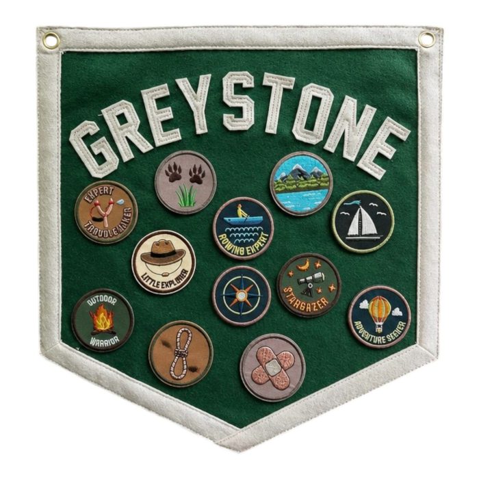Green Greystone felt pennant with hiking, sailing and camping activity patches
