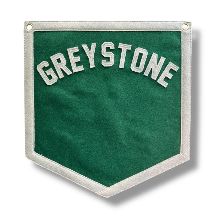 Green felt Greystone pennant with cream arched lettering