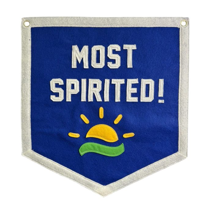 Blue felt banner reading Most Spirited with a yellow and green sunrise applique