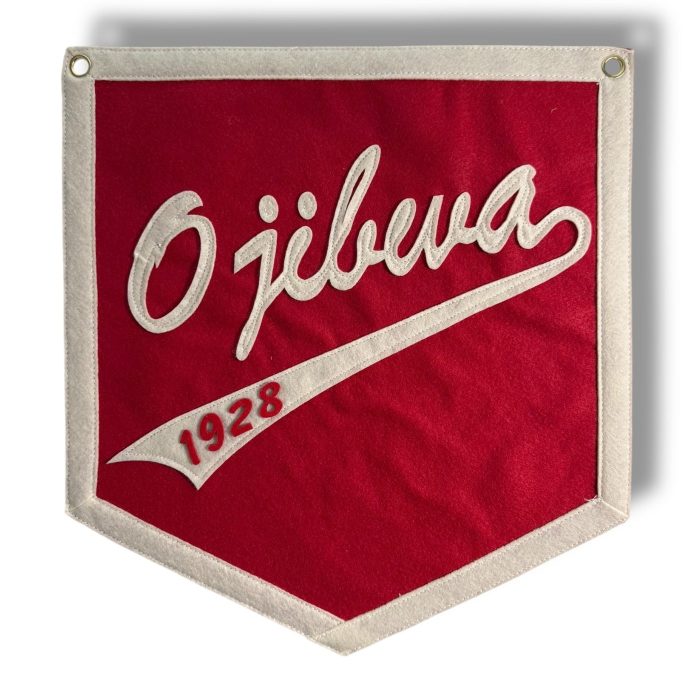 Red felt banner with cream script lettering reading Ojibwa 1928