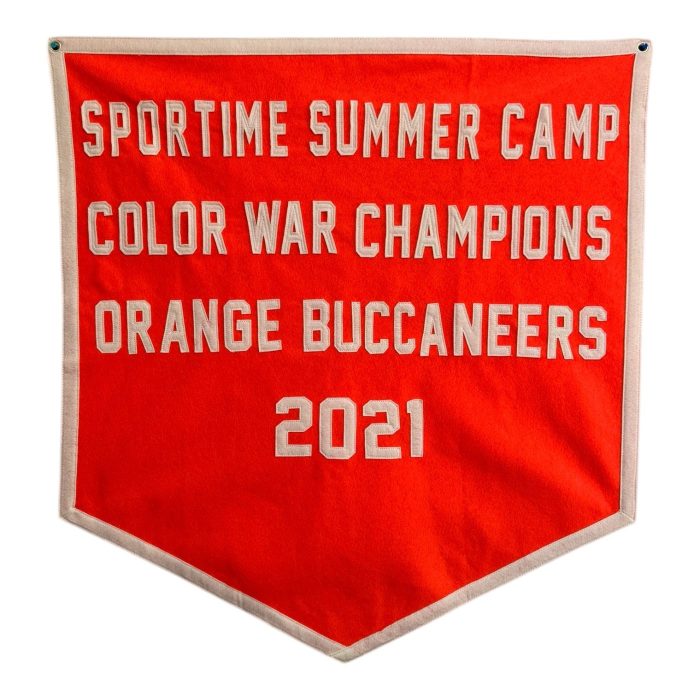 Orange felt banner reading Sportime Summer Camp Color War Champions Orange Buccaneers 2021
